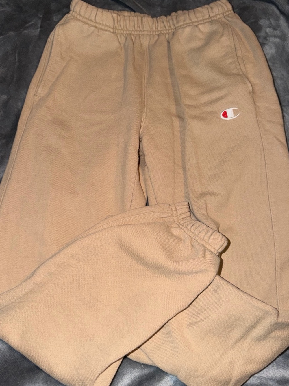 Tan Champion sweatpants.